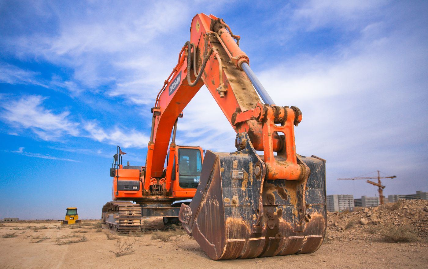 Excavator loading on a worksite